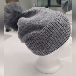 Grey slouchy knit crystal beanie with faux fur pompom